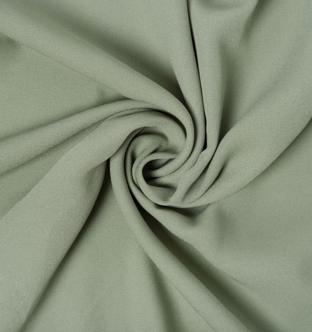 Here is the image of the light green color cloth which is the material example of viscose material which is made using the best yarn weaving machine in India