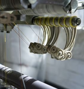 Here is the image of the Air jet loom machines which are used for Yarn weaving and making clothes. These machines are designed by the best Air Jet looms machine manufacturer in Surat Paramount Looms.