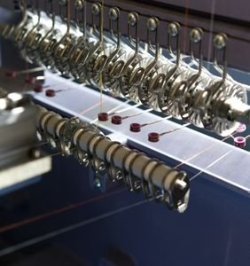 Here is the image of the Rapier loom machines which are used for Yarn weaving and making clothes. These machines are designed by the best Rapier looms machine manufacturer in Surat Paramount Looms.